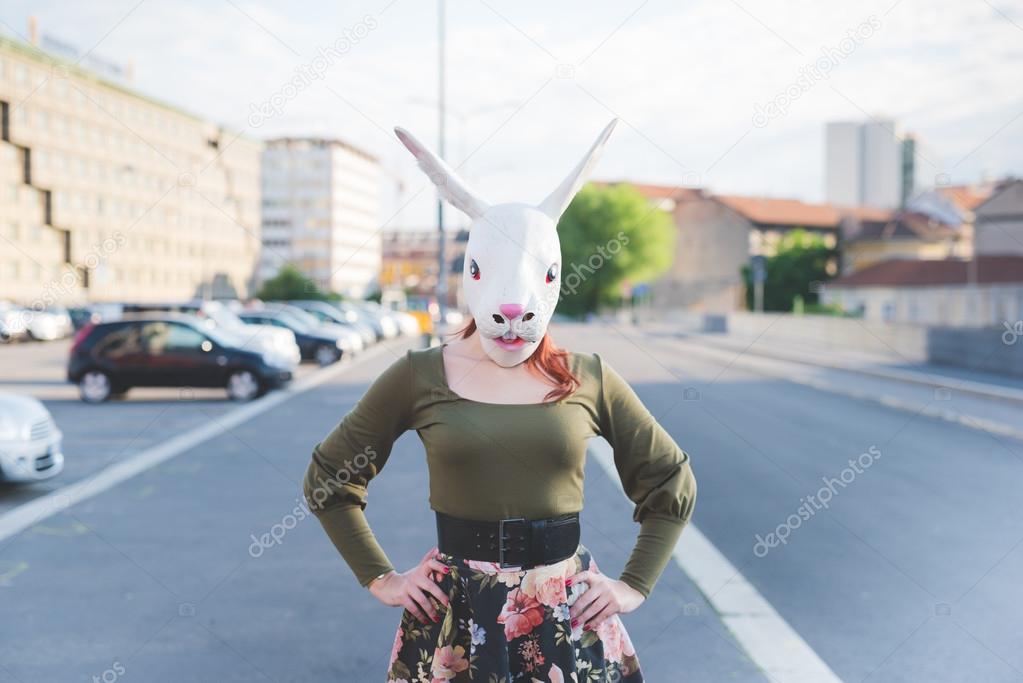 redhead woman with rabbit mask