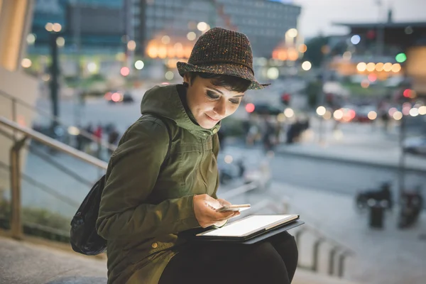 Woman holding smartphone and tablet — Stok fotoğraf