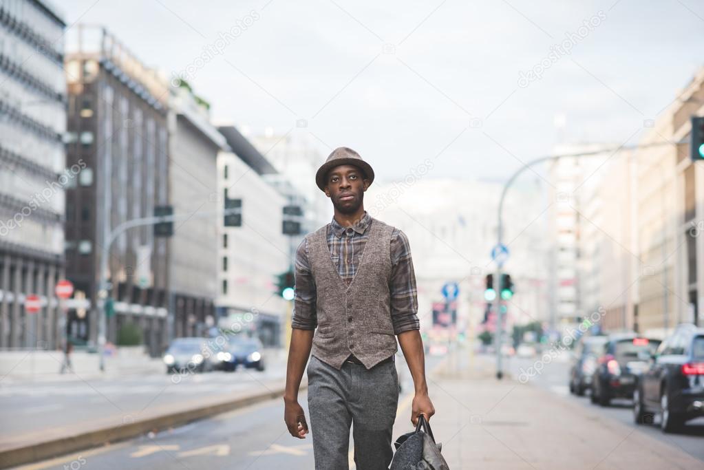 Afro black man walking in the street