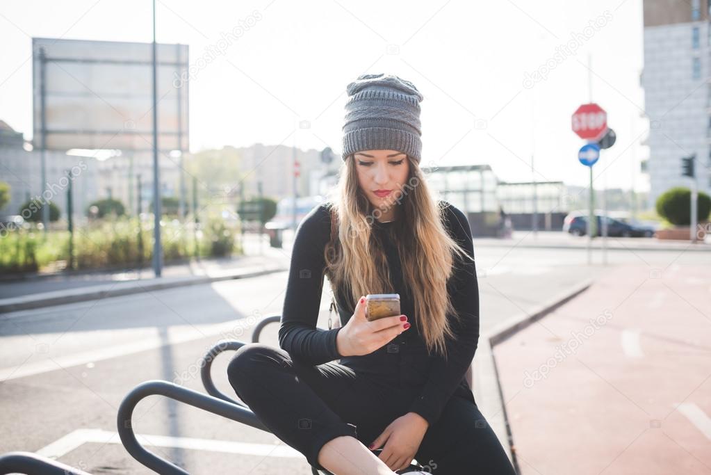 woman sitting outdoor in city