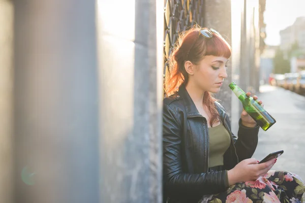 Redhead woman using smartphone — Stock Photo, Image