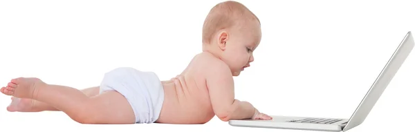 Side view of cute baby boy using laptop — Stock Photo, Image