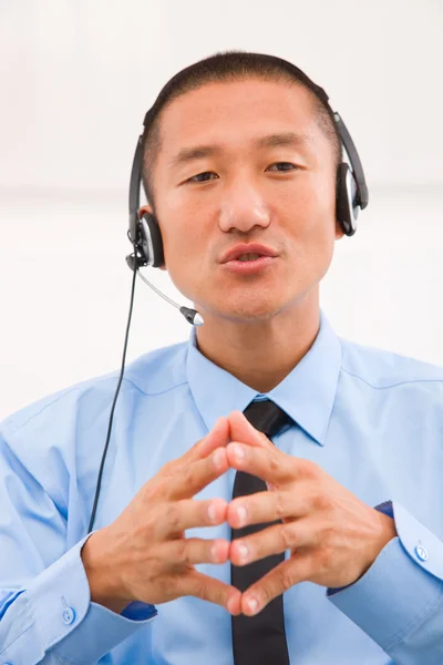 Close-up of male customer service representative wearing headset — Stock Photo, Image