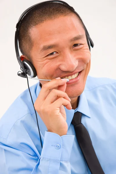 Close-up of smiling male customer service representative wearing — Stock Photo, Image