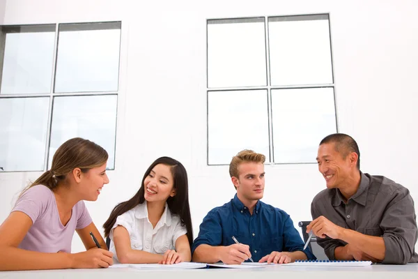 Diverse happy business people in meeting — Stock Photo, Image
