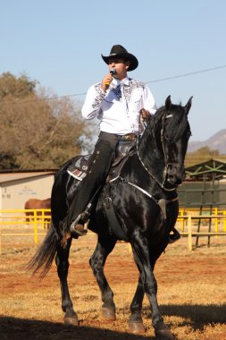 Armand the singing cowboy on his black stallion