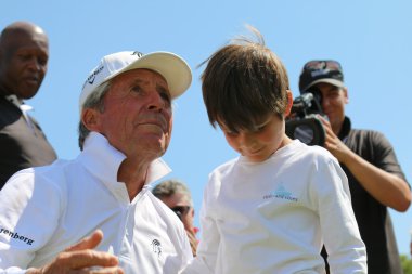 Tournament presenter and grand master Gary Player with grandson,