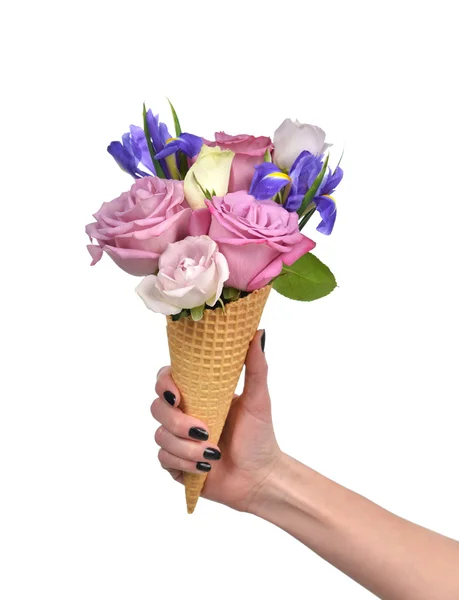 Woman hand holding roses and iris flowers in waffle cones close — ストック写真