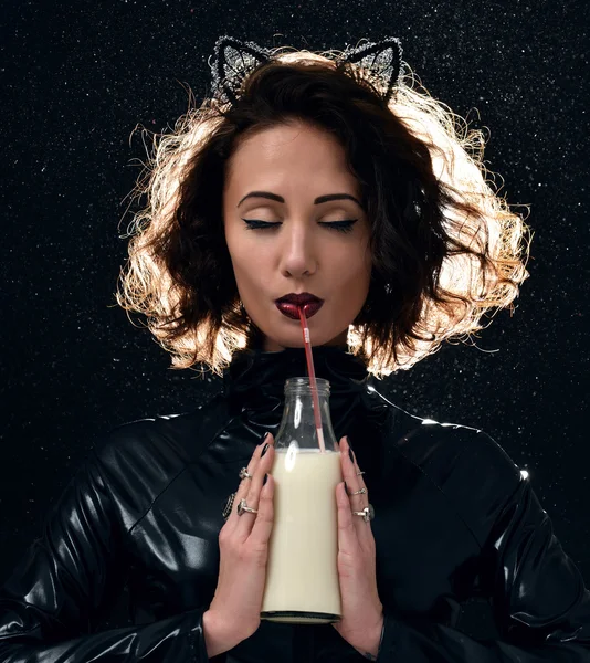 Portrait of beautiful fashion woman drinking milk from the bottl — Stock Photo, Image