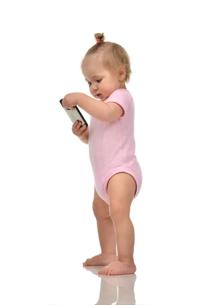 Happy infant child baby boy standing playing with mobile cellpho — Stock Photo, Image