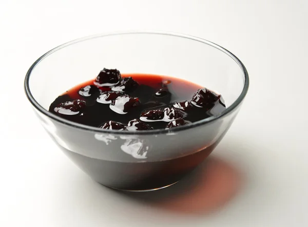 Sweet cherries jam in the transparent glass bowl — Stock Photo, Image