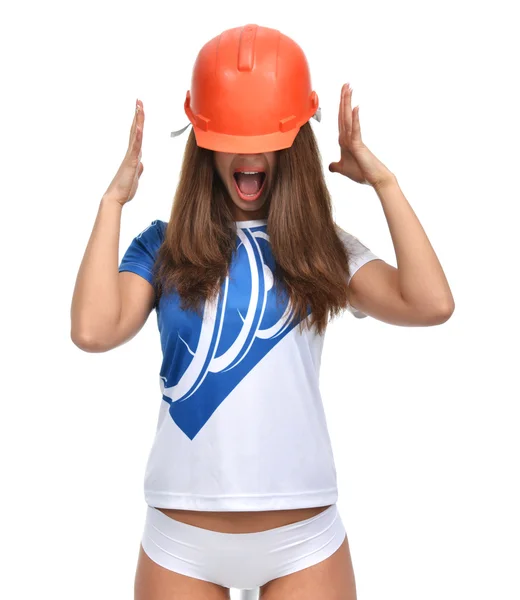 Young beautiful woman yelling screaming in orange construction h — Stock Photo, Image
