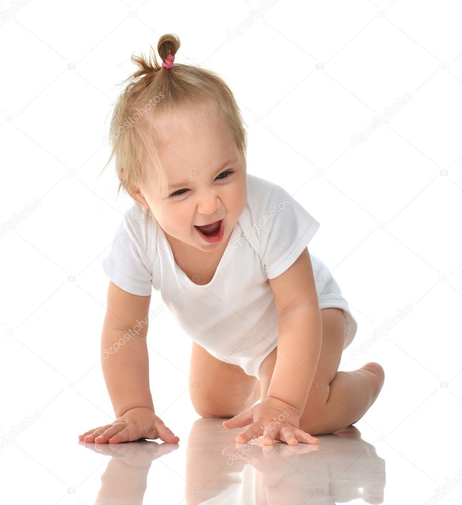 Infant child baby girl in diaper crawling happy laughing smiling