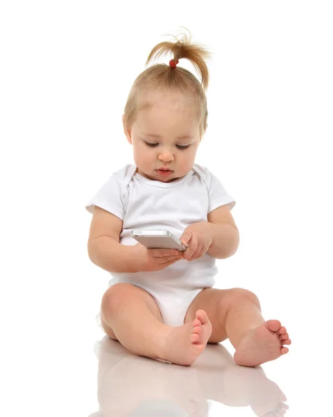 Happy infant child baby boy sitting smiling playing texting by m — Stock Photo, Image