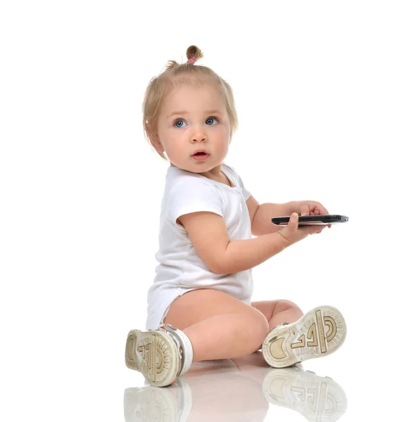 Happy infant child baby boy sitting with mobile cellphone and lo — Stock Photo, Image