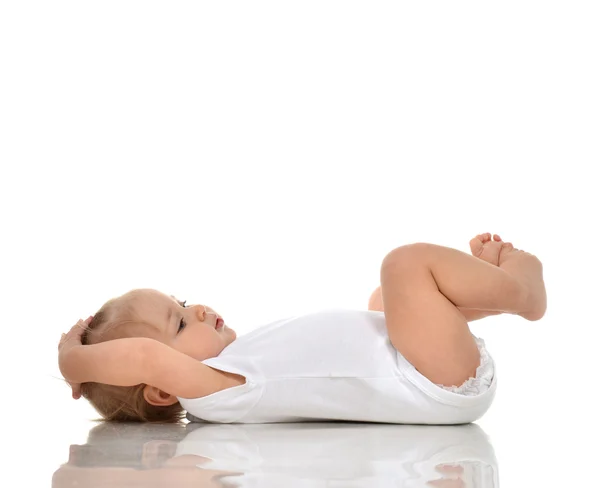 Funny Infant child baby girl in diaper lying on a back and looki — Stock Photo, Image