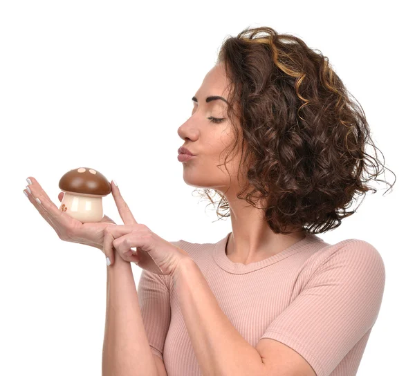 Pretty curly woman with fake mashroom in hand smiling — Stock Photo, Image