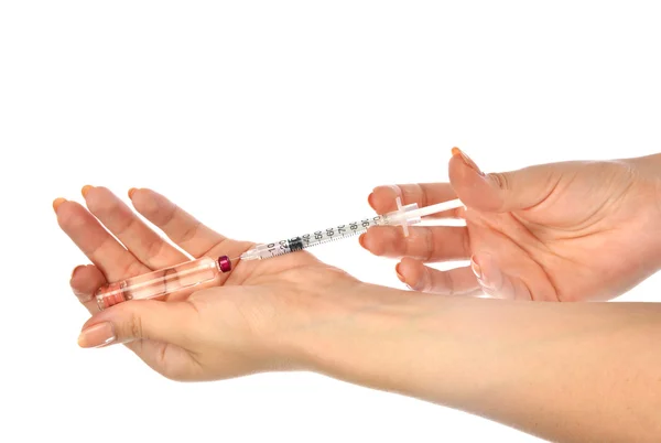 Doctor hands with medical syringe with needle in ampule — Stock Photo, Image