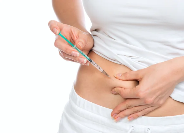 Medical diabetes insulin syringe injection shot into abdomen wit — Stock Photo, Image