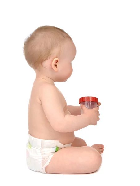 Infant child baby girl in diaper sitting backward with empty pla — Stock Photo, Image