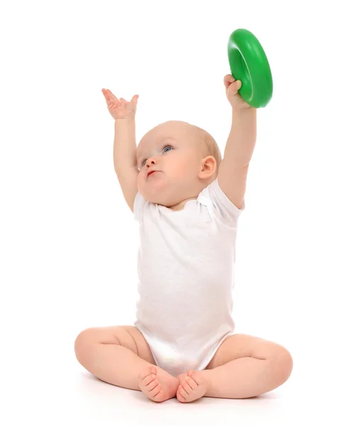 Infant child baby boy toddler playing holding green circle in ha — Stock Photo, Image