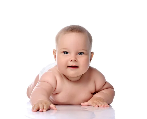 Infant child baby girl kid in diaper lying happy looking at the camera isolated on a white — Stock Photo, Image