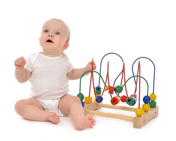 Infant child baby toddler standing playing wooden educational to — Stock Photo, Image