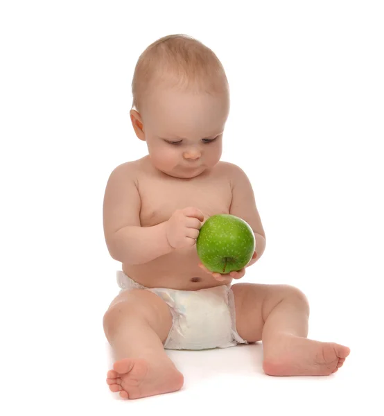 Infant child baby toddler sitting in diaper with green apple — Stock Photo, Image