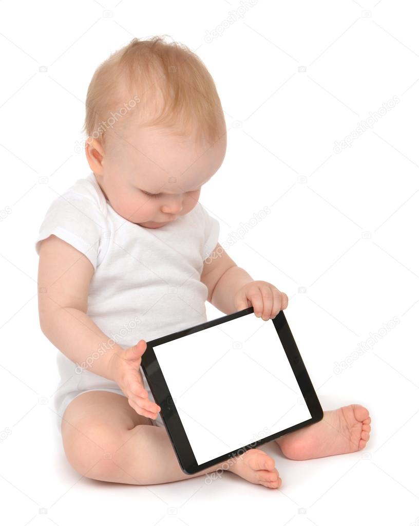 Infant child baby toddler sitting and typing digital tablet mobi