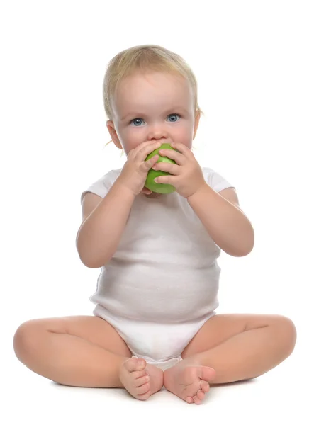 Infant child baby infant girl eating apple — Stock Photo, Image