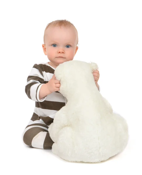Infant child baby girl hugging soft teddy bear — Stock Photo, Image