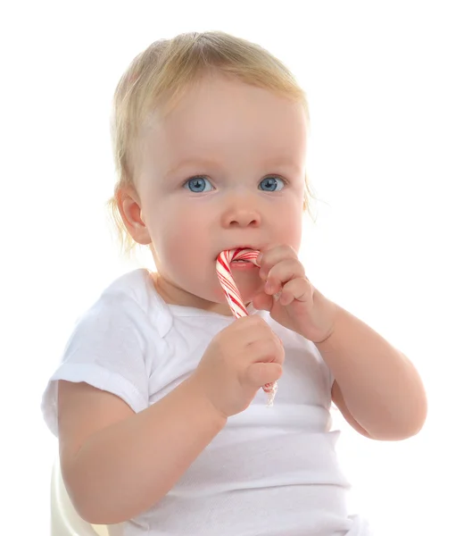 Bebek çocuk bebek çocuk yürümeye başlayan çocuk Noel şeker kamışı yeme — Stok fotoğraf
