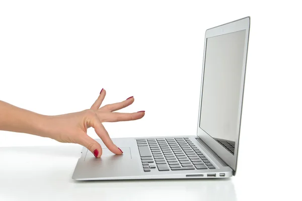 Hand working on keyboard computer laptop touchpad — Stock Photo, Image