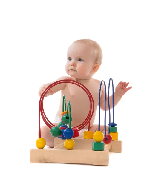 Infant child baby toddler standing and playing wooden educationa — Stock Photo, Image