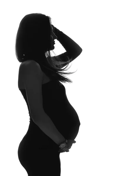 Pregnant woman silhouette on a white background text space — Stock Photo, Image