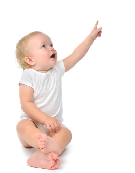 Infant child baby toddler sitting raise hand up pointing finger Stock Photo