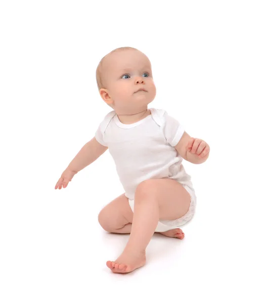 Infant child baby toddler sitting and looking at the corner — Stock Photo, Image