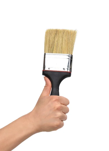 stock image Woman hand with paint brush with plastic wooden handle