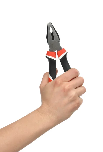 Woman Hand holding big pliers with black and red handles — Stock Photo, Image