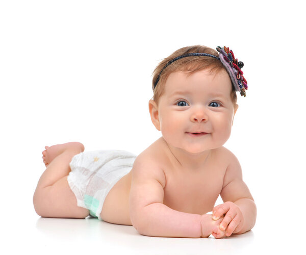 Four month Infant child baby girl in diaper lying happy smiling