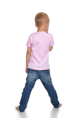 Rear view of caucasian full body american baby boy kid in pink t