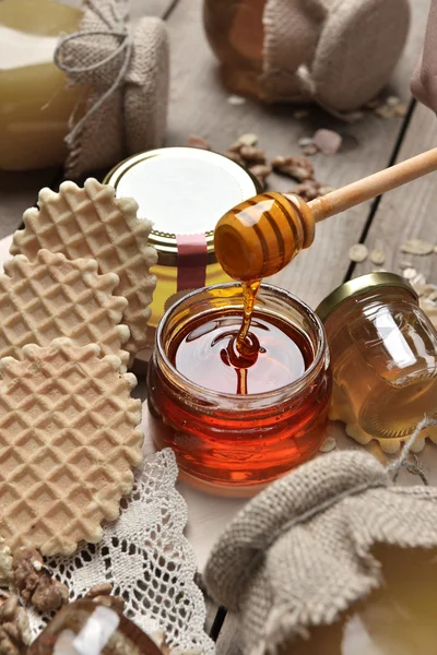 Honey in a jar on an old vintage wood table rural rustic style — Stock Photo, Image