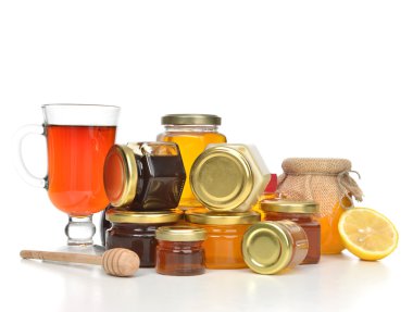 Tasty jars of jam and honey cream lemon and tea  clipart