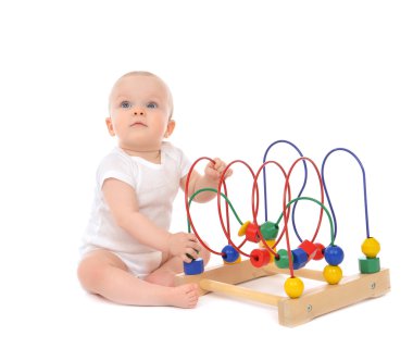 9 month child baby toddler standing and playing wooden education