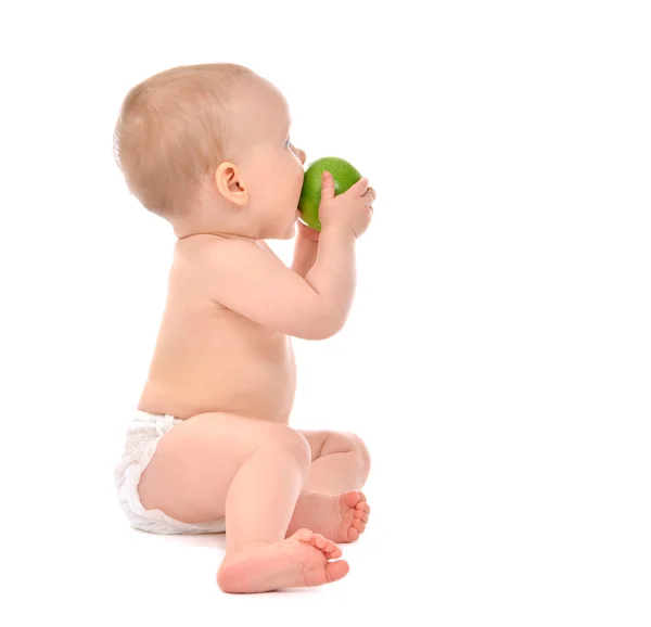 Infant child baby infant girl eating apple closeup — Stok fotoğraf