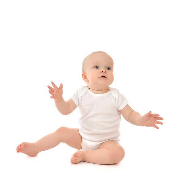 Infant child baby toddler sitting hands up surprised — ストック写真