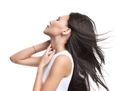 Beautiful asian brunette girl with healthy long hair isolated 