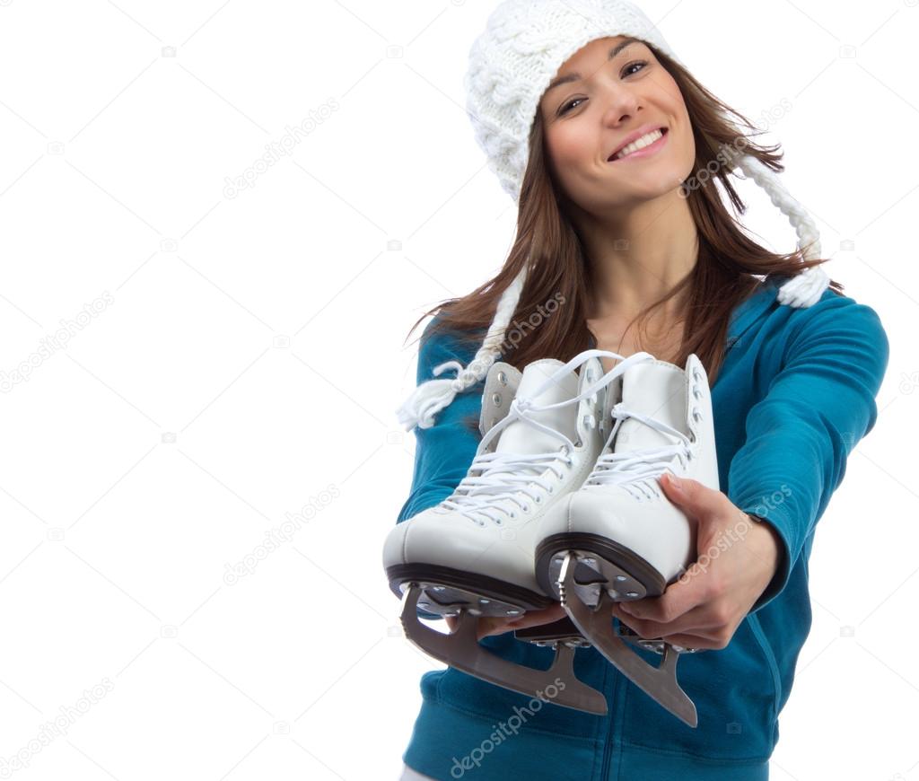Young girl showing giving ice skates for winter ice skating spor