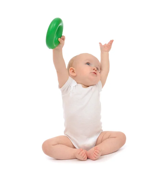 Infant child baby boy toddler playing holding green circle in ha — Stock Photo, Image