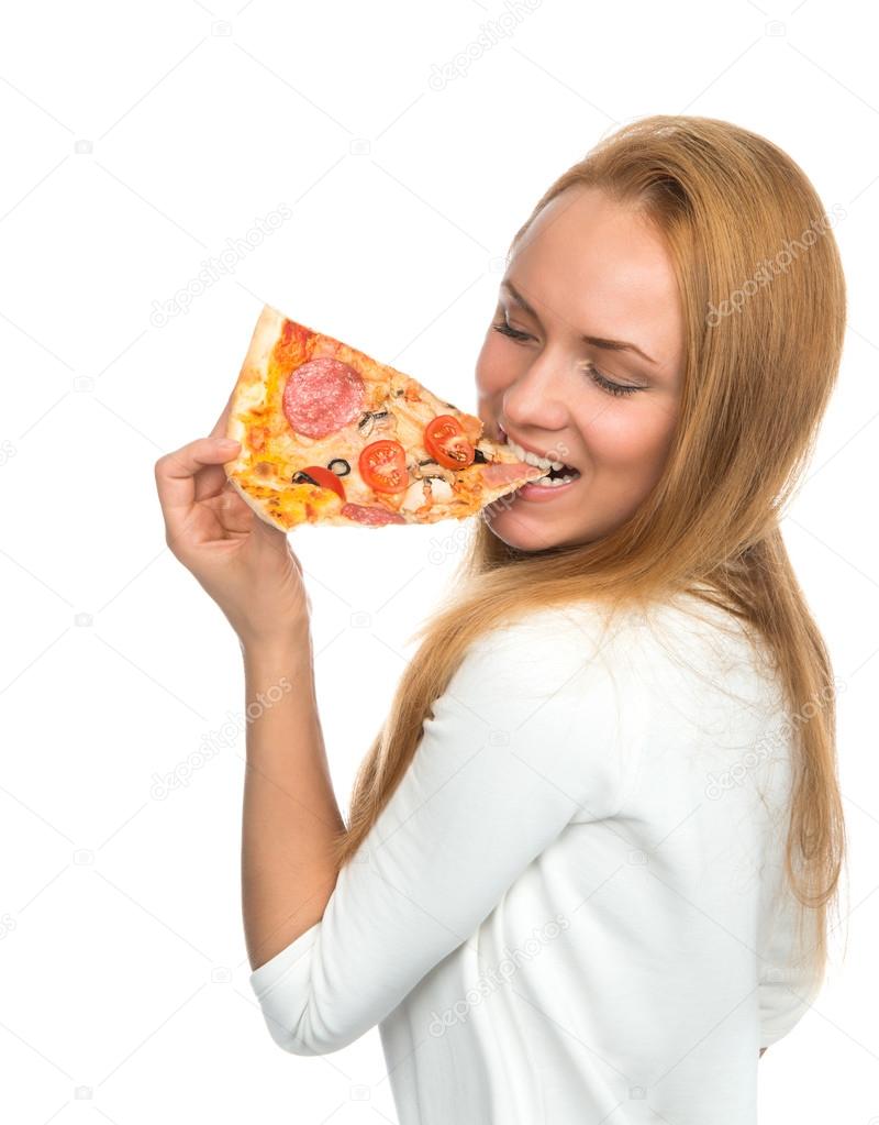 Happy woman enjoy eating slice of pepperoni pizza with tomatoes